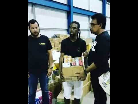 JAH CURE DONATING FOOD TO HAITI RELIEF